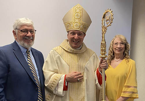 Joanna Pietrapaoli Stillwagon and Richard Stillwagon with Bishop Larry Kulick